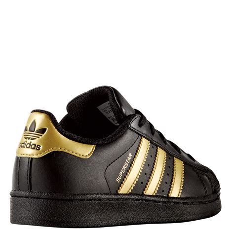 gold schwarz adidas|adidas men's shoes gold.